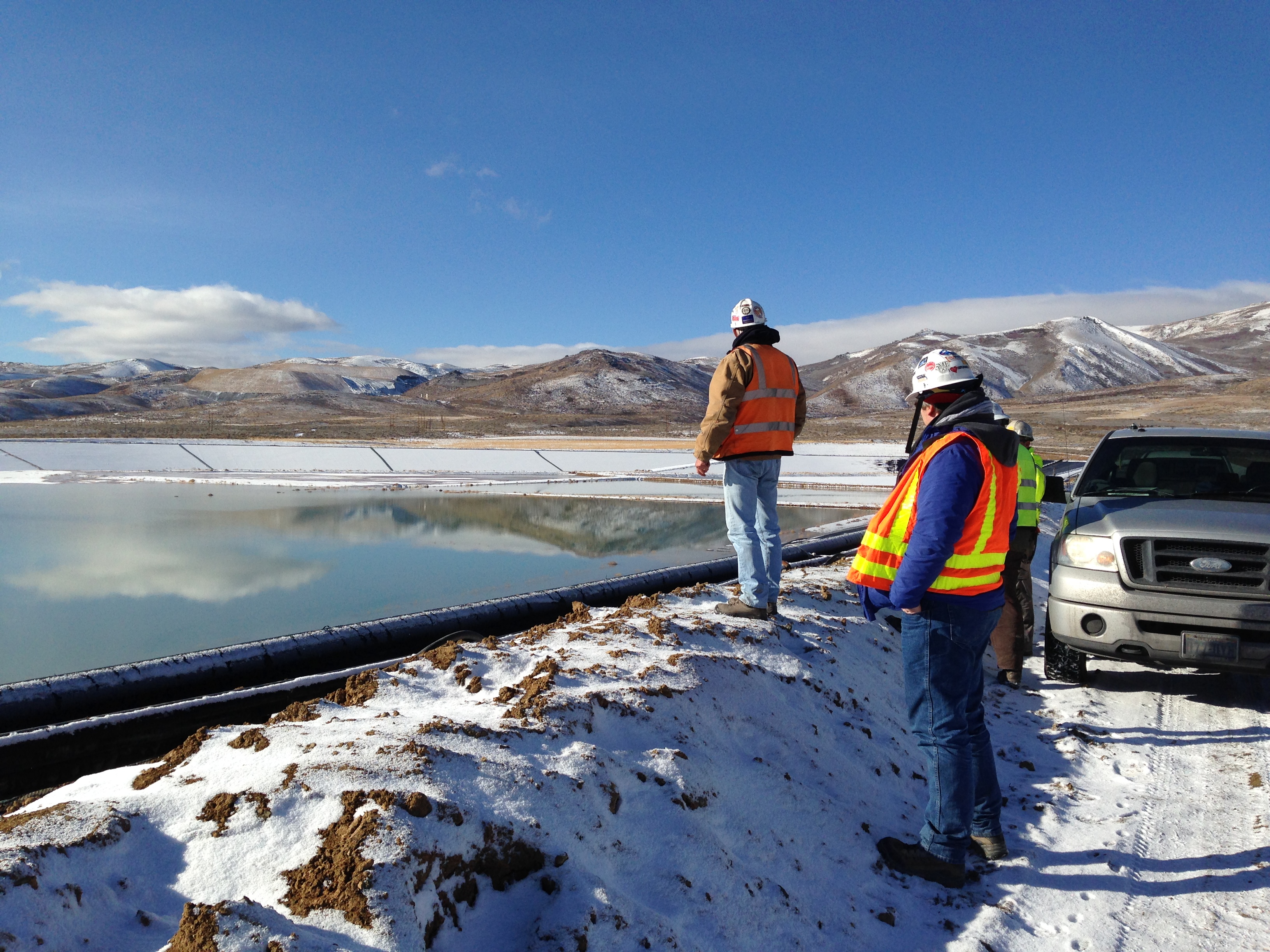 BMRR employees inspecting a tailings impoundment.