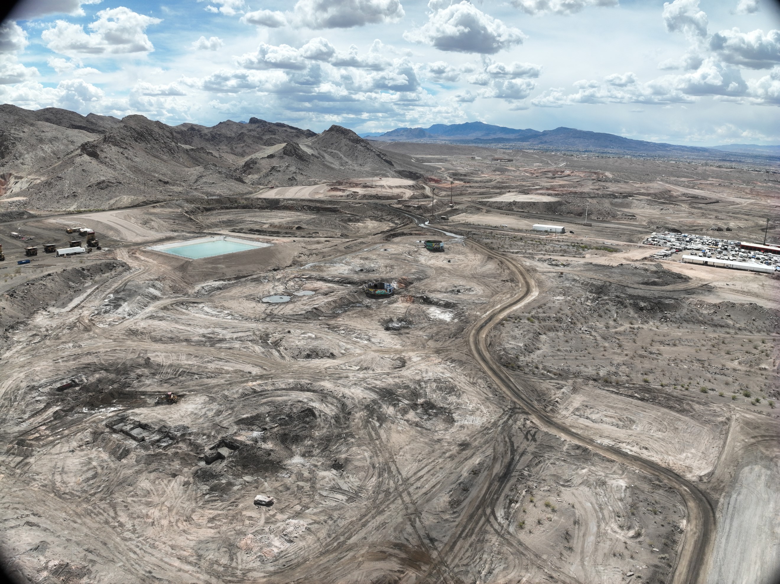 Former features of the Three Kids Mine site included open pits, tailings ponds, overburden, flotation tank foundations, and ore yard.